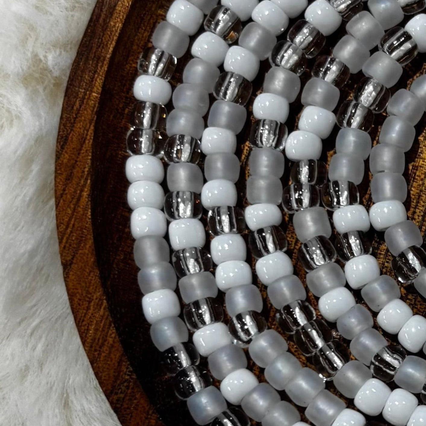 “Minimalist white and neutral waist beads handcrafted by Waisted By Design”