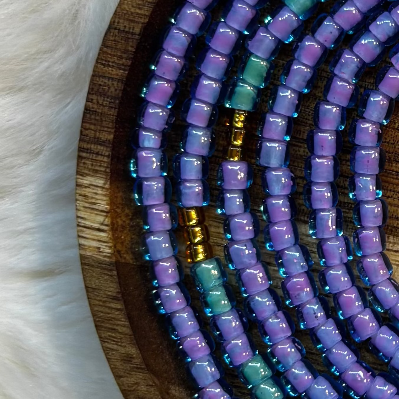 “Whimsical pastel waist beads with iridescent tones by Waisted By Design”