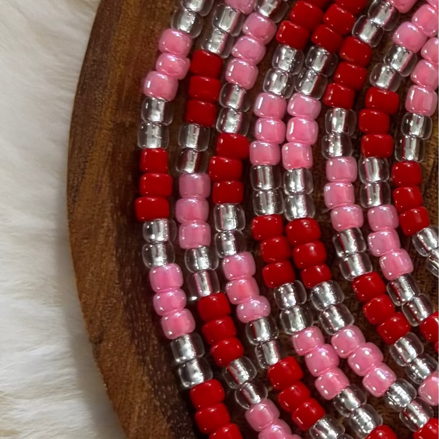 “Valentine inspired waist beads with romantic red and pink tones by Waisted By Design”