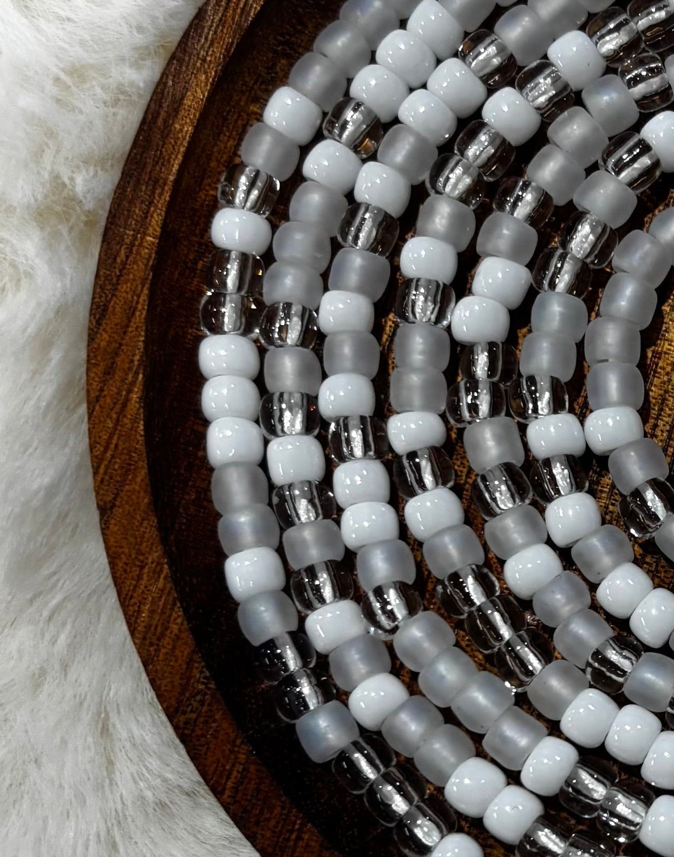 “Minimalist white and neutral waist beads handcrafted by Waisted By Design”