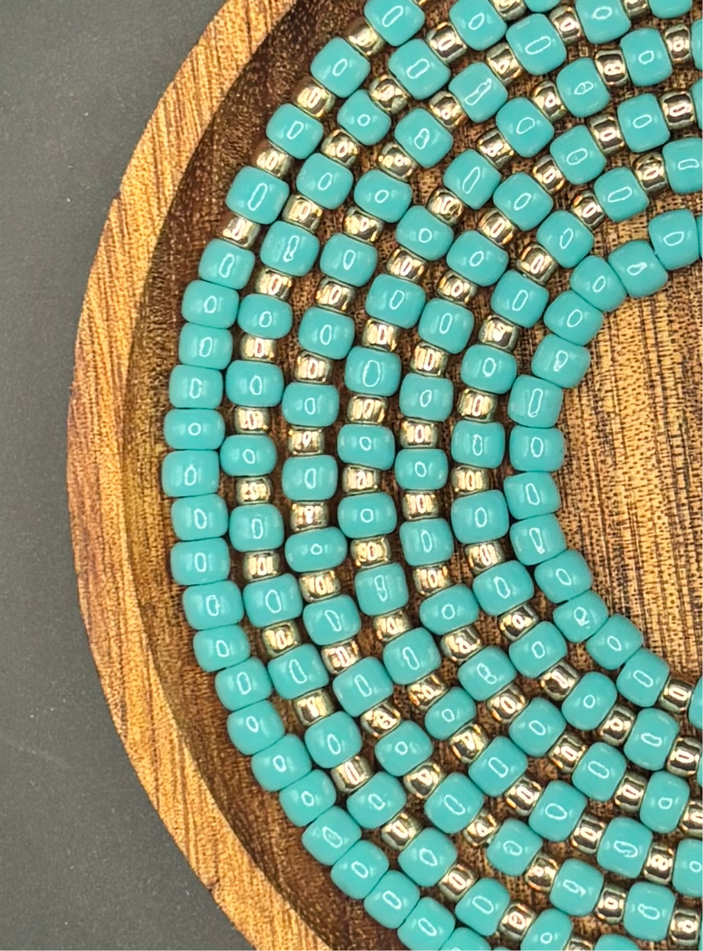Turquoise and gold waist bead set called Coastal Crown, handcrafted with premium Toho seed beads in rich ocean blue tones and metallic gold accents, fixed 50-inch length, lightweight and designed for elegant everyday wear by Waisted by Design™.