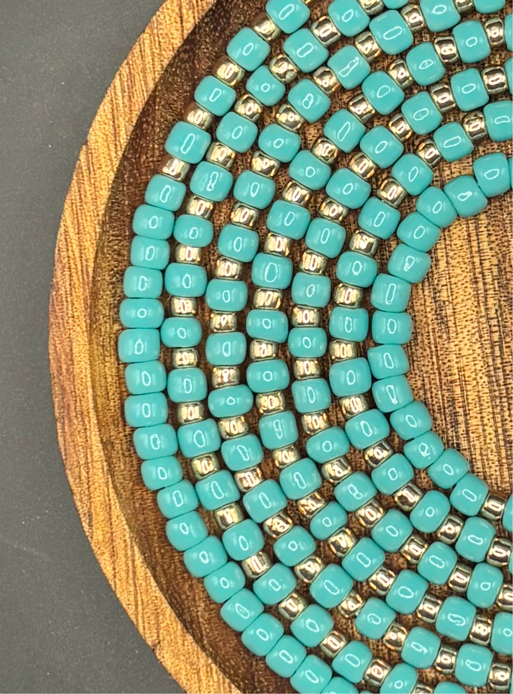 Turquoise and gold waist bead set called Coastal Crown, handcrafted with premium Toho seed beads in rich ocean blue tones and metallic gold accents, fixed 50-inch length, lightweight and designed for elegant everyday wear by Waisted by Design™.