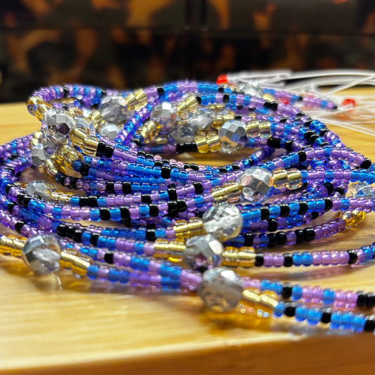 Colorful beaded bracelets on a wooden surface with a tortoiseshell-patterned background