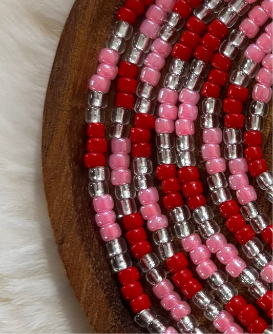 “Valentine inspired waist beads with romantic red and pink tones by Waisted By Design”