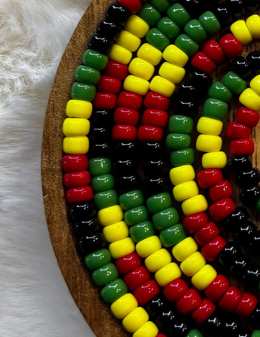 “Rasta inspired waist beads in red gold and green by Waisted By Design”