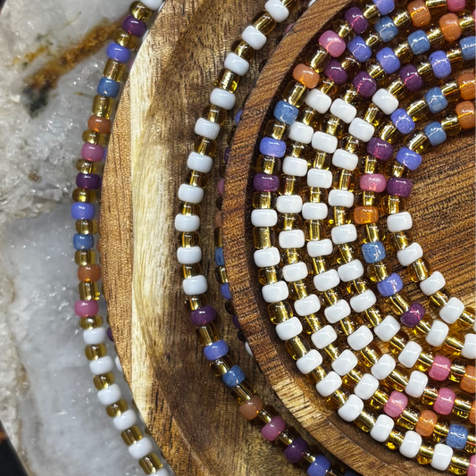 Handmade Solenne waist beads featuring luminous luxury-toned seed beads with a soft shimmer, designed for an elegant and feminine waist adornment.